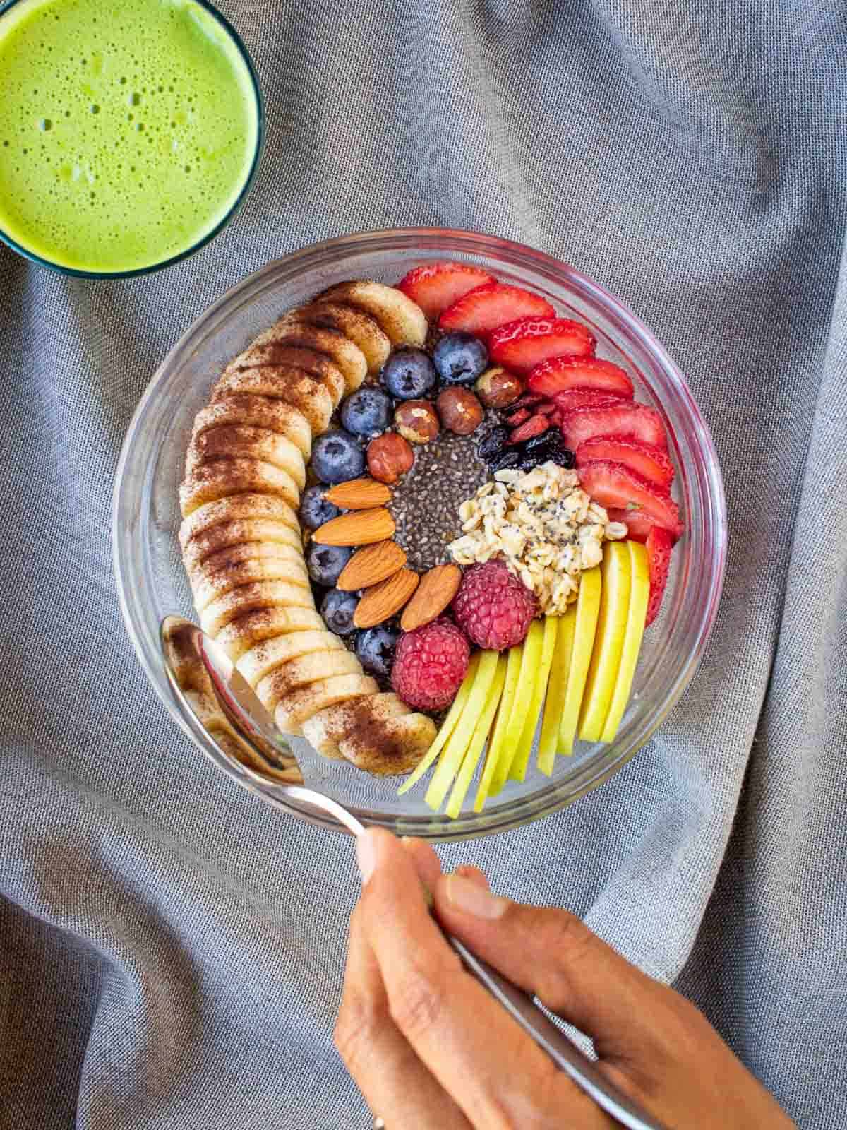 Scooping on a breakfast Fruit bowl.