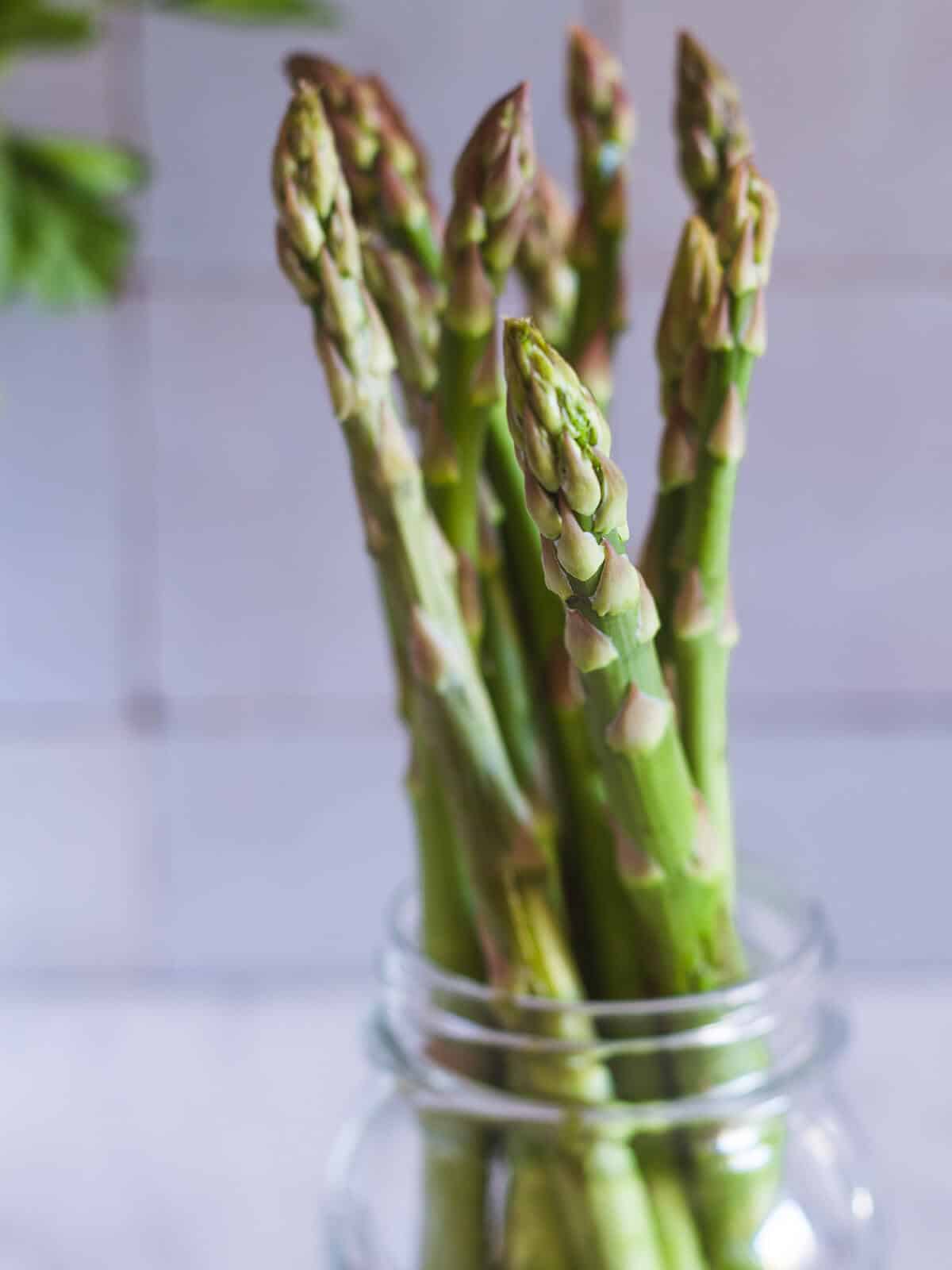 asparagus in a glass bottle