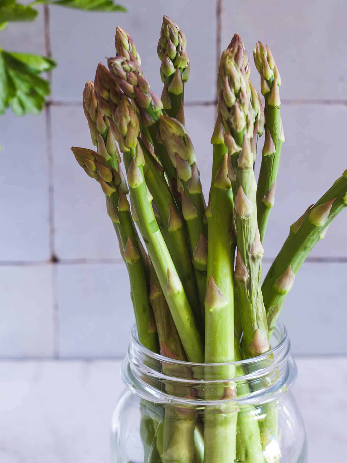 asparagus in a glass bottle