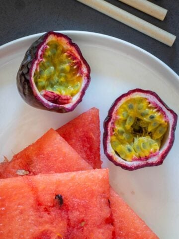 halved passion fruit and watermelon juice  chunks ready to be blended.