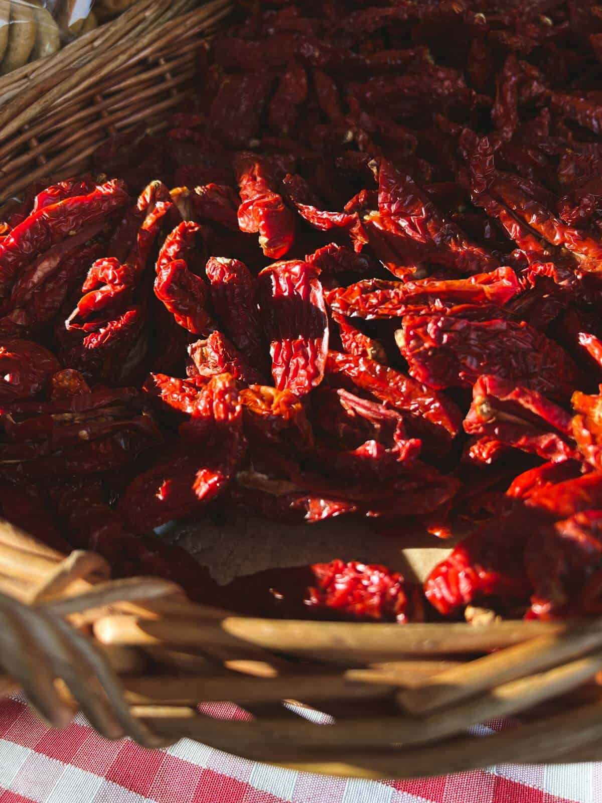 dried tomatoes in a basket at the farmer's market