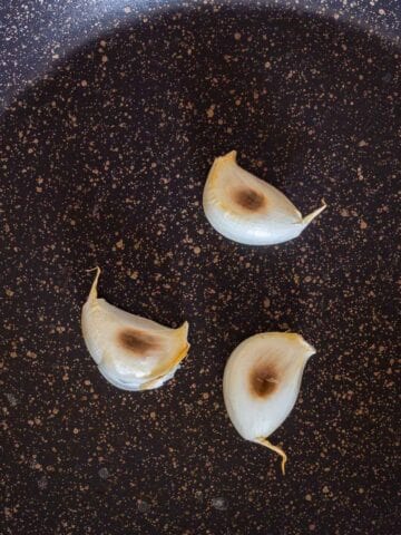 rosting garlic in a skillet.