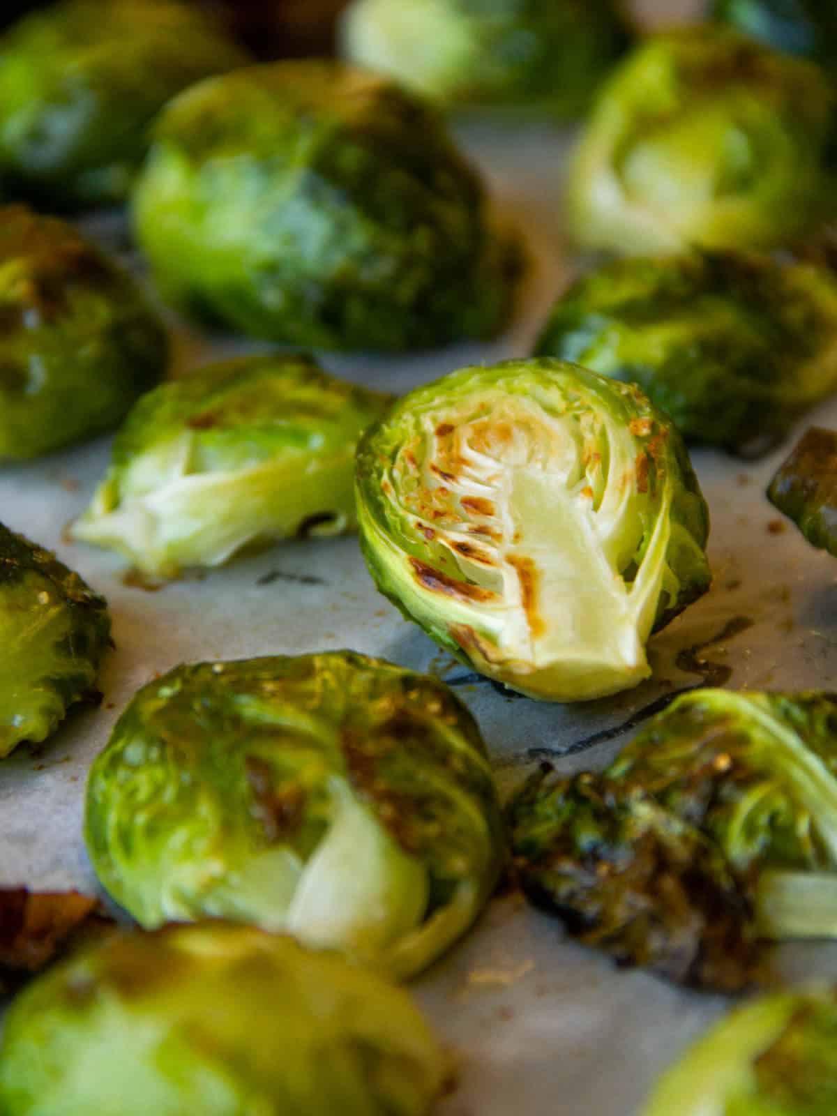 freshly roasted healthy Brussels sprouts still in parchment paper.