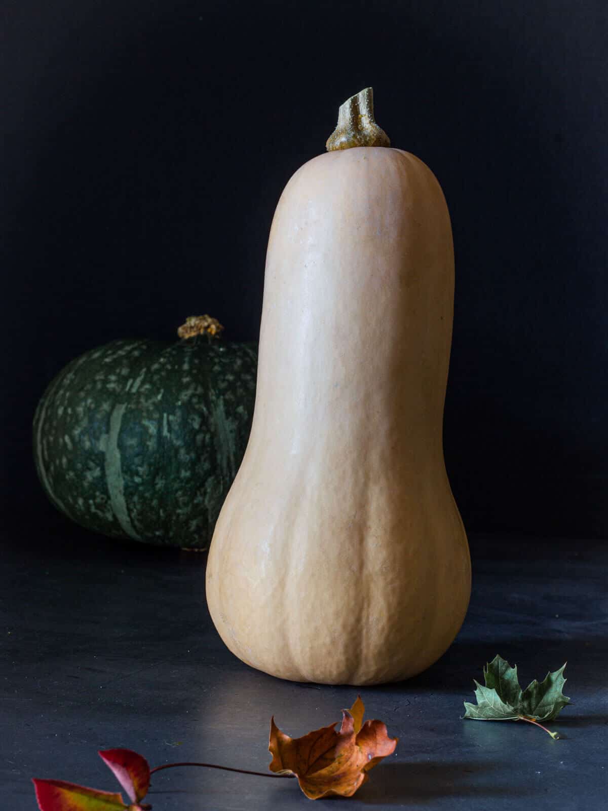 butternut squash standing on table.