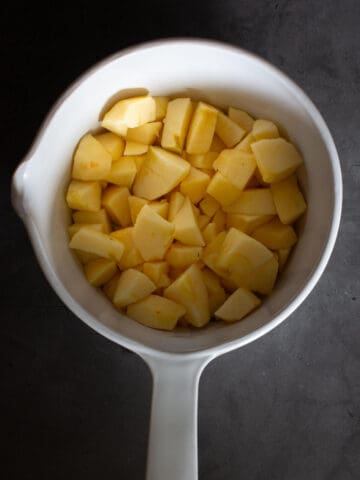 chopped apples in pot Unsweetened applesauce chopped apples