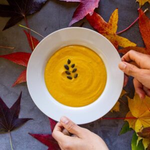 pumpkin tahini soup hand