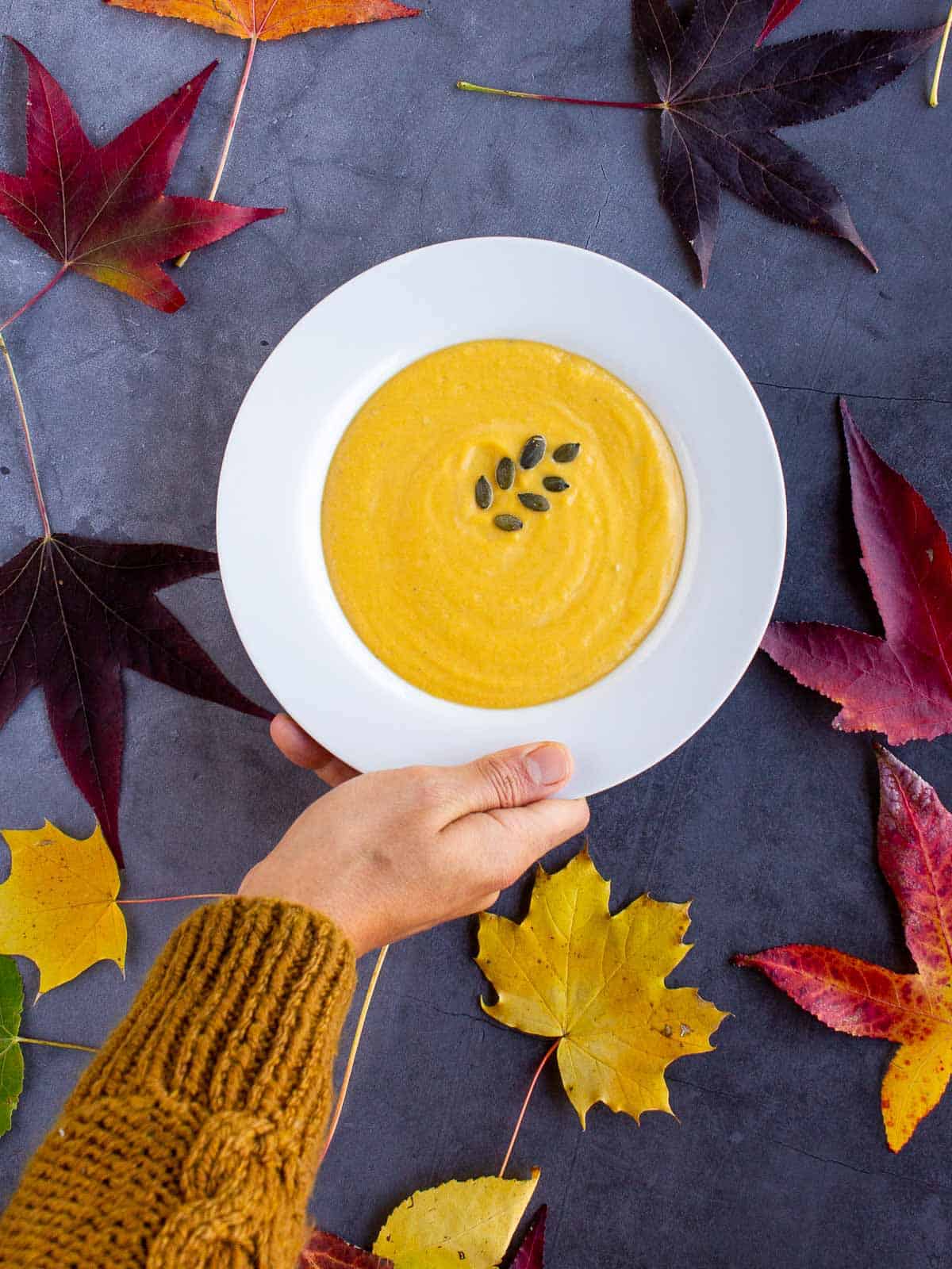 pumpkin tahini soup hand