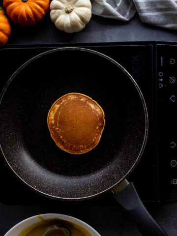 flipping pancakes in nonstick pan.
