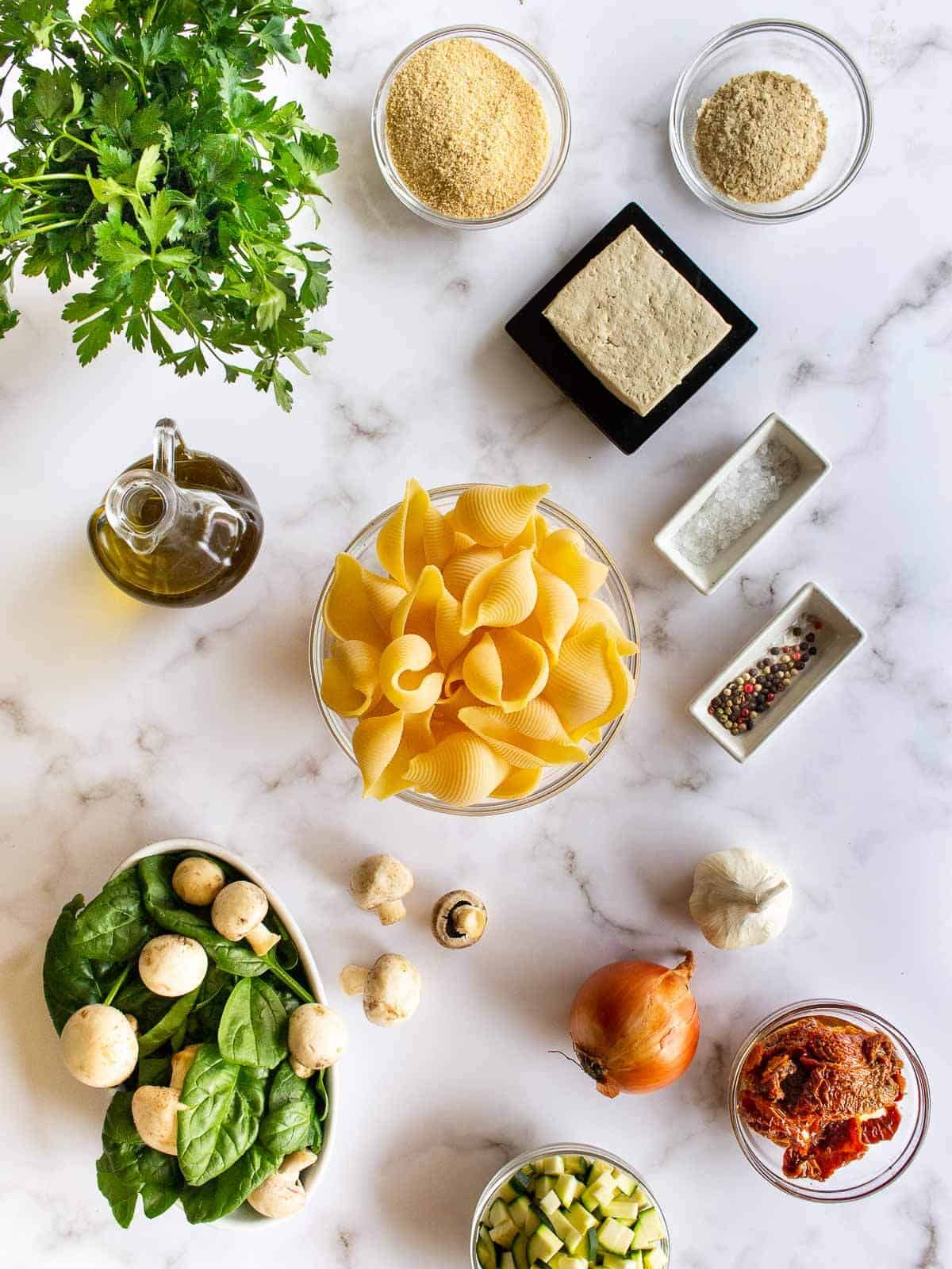 ingredients to make tofu pesto pasta with jumbo pasta shells.