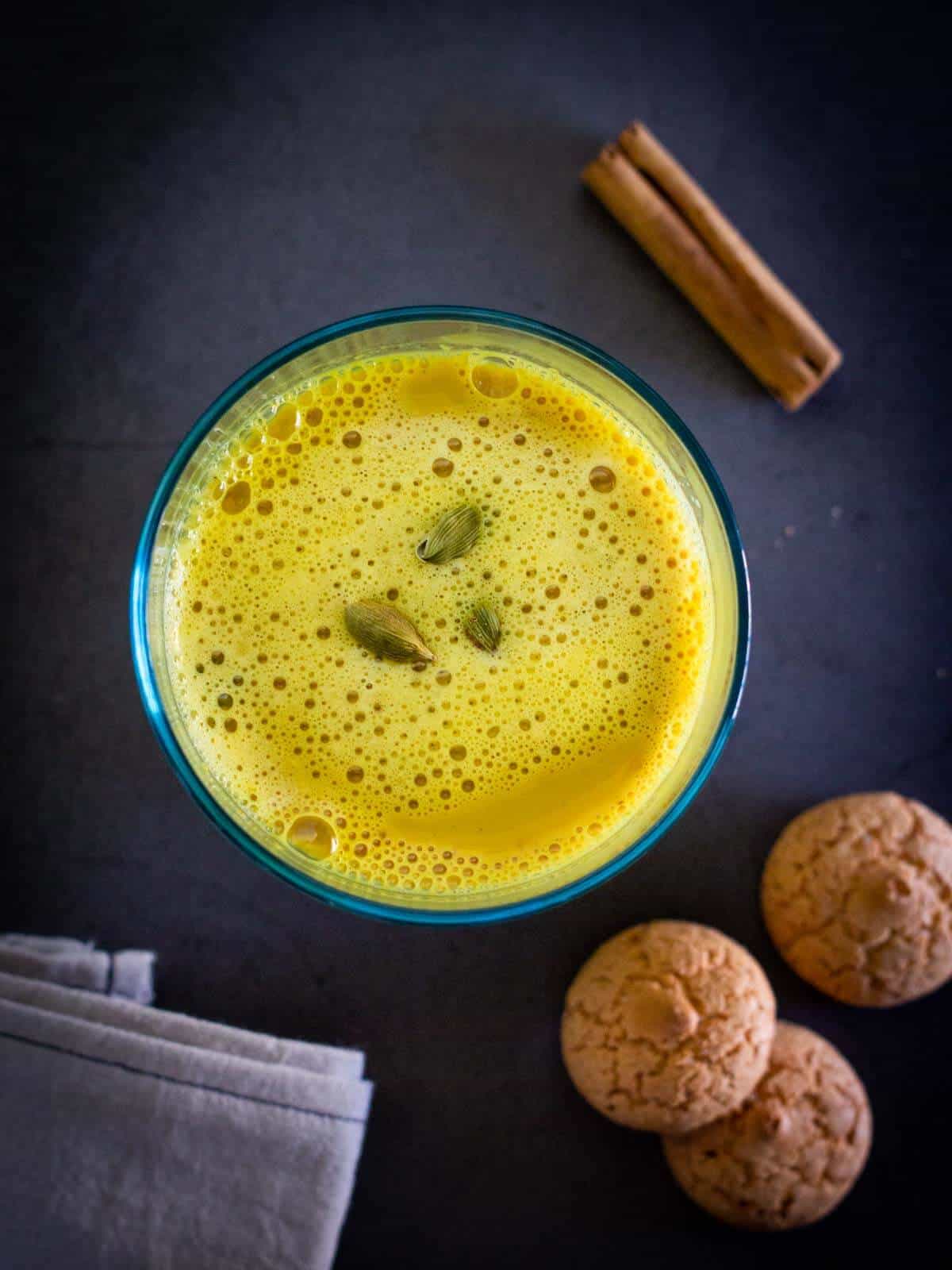 vegan golden milk served with amaretti cookies