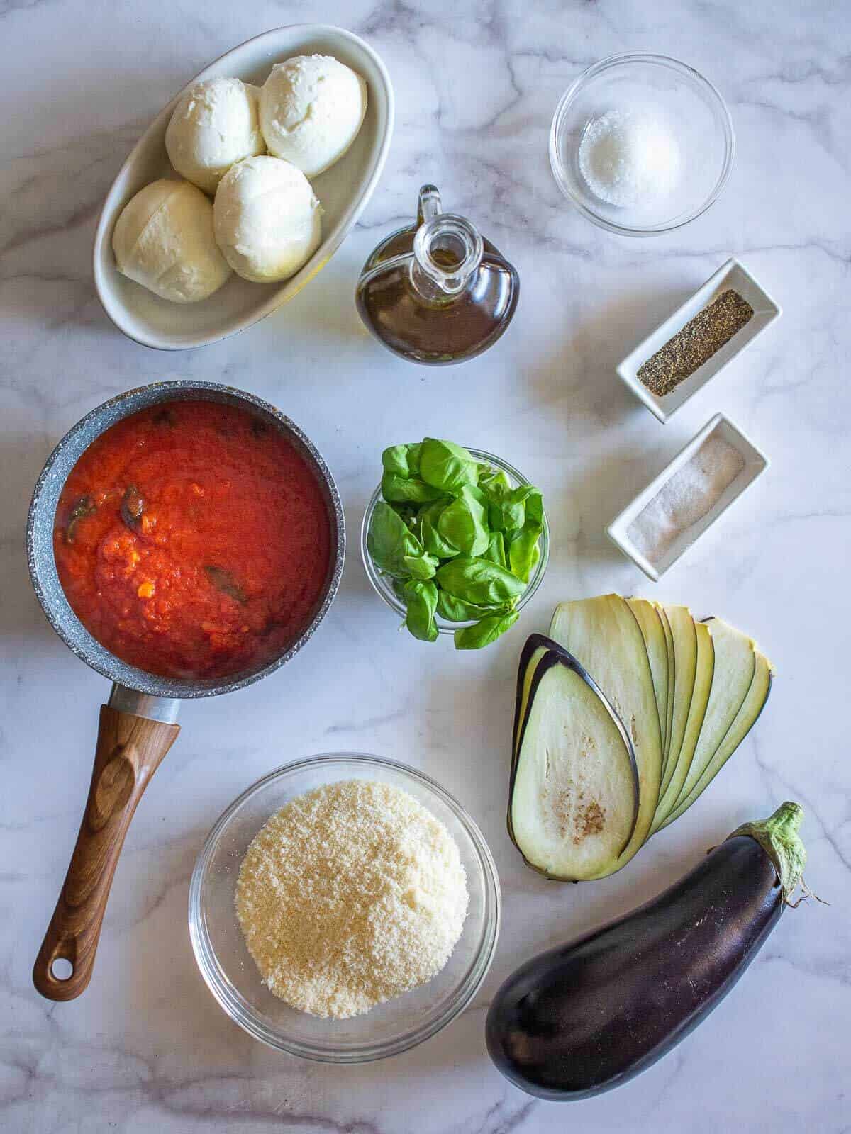 eggplant parmesan ingredients on a table.