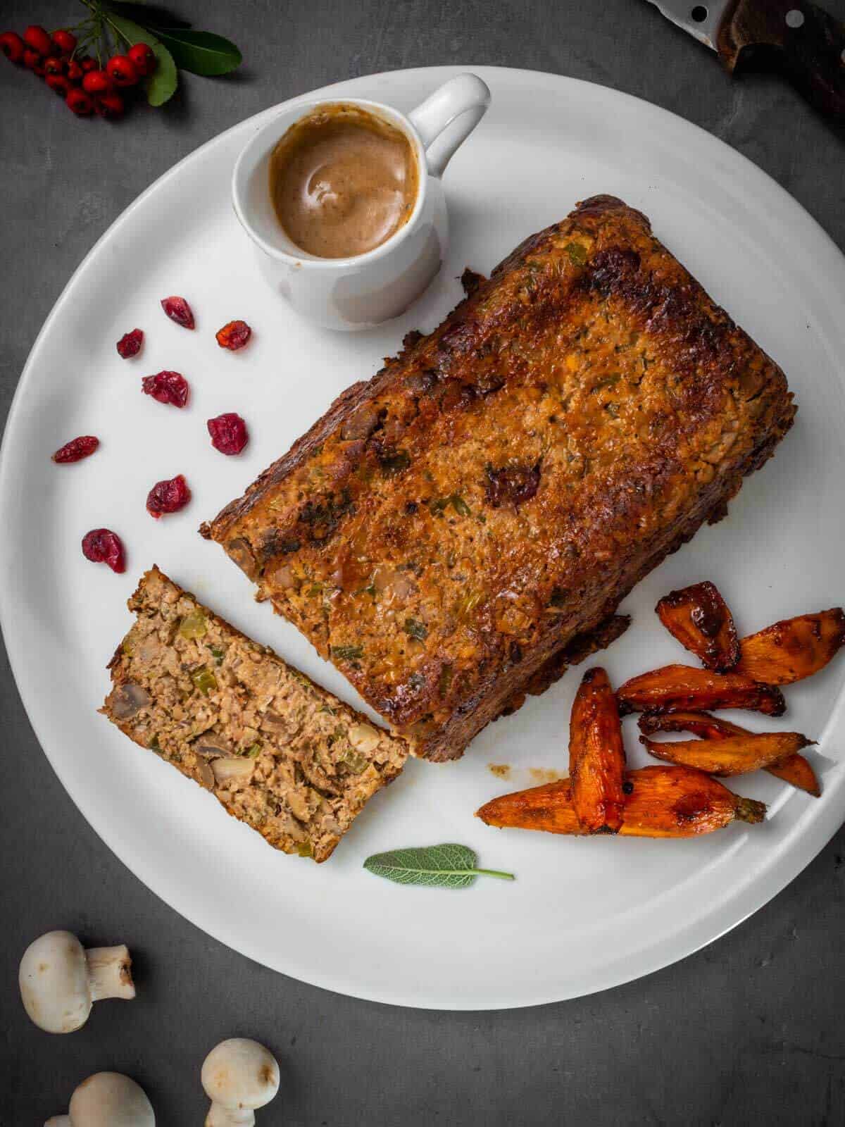 plate vegan roast with gravy and veggies