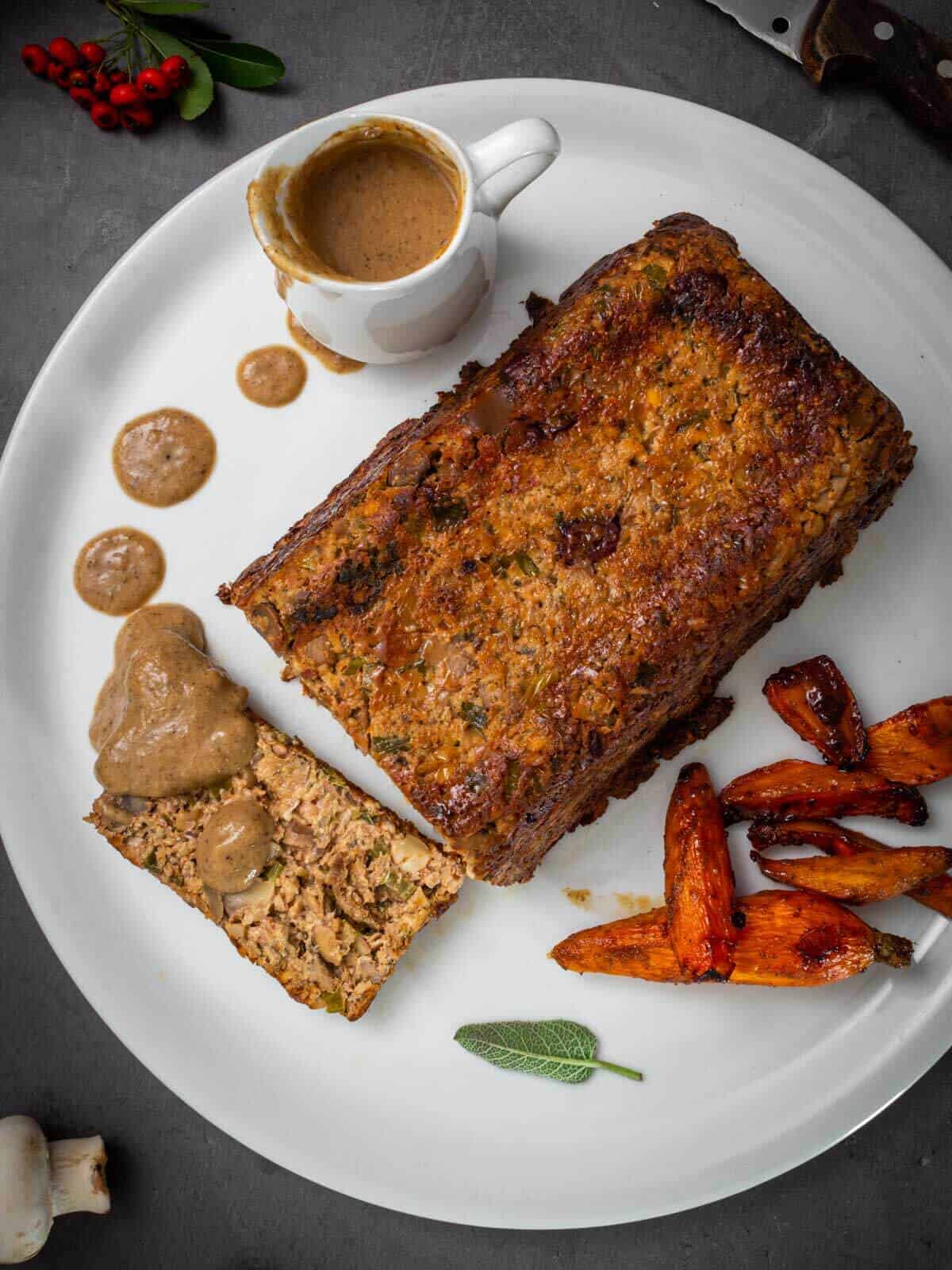 plate vegan roast with gravy and veggies