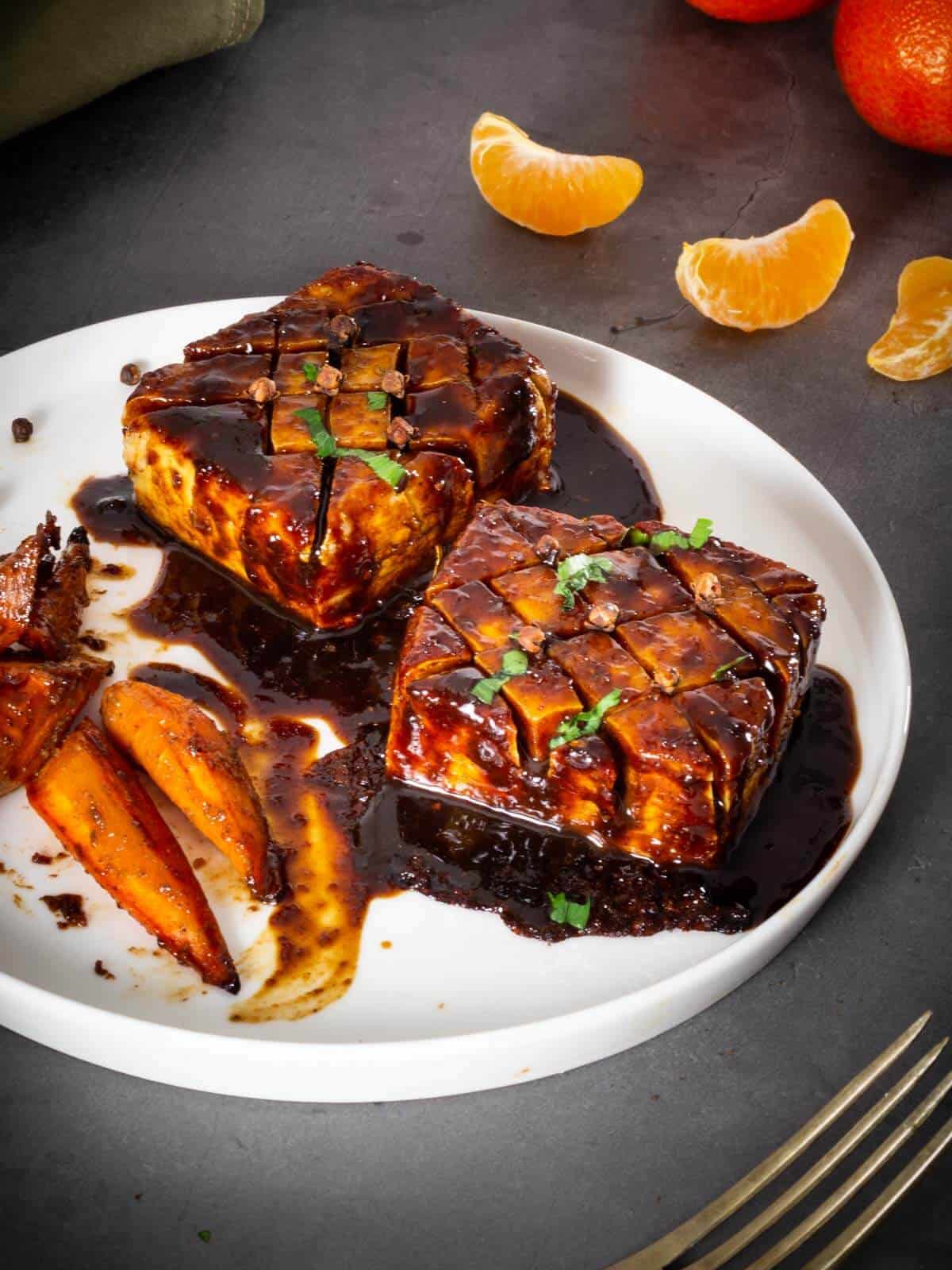 plated marinated baked tofu with glazed carrots.