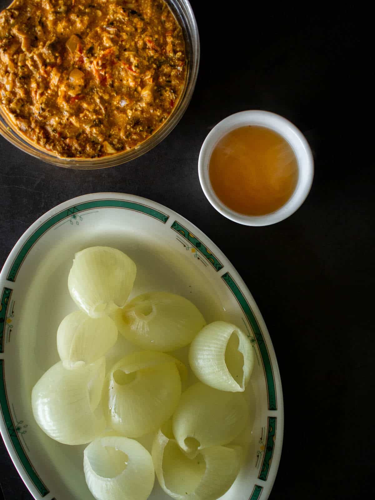 cooked onion layers with tofu stuffing ready to be stuffed.