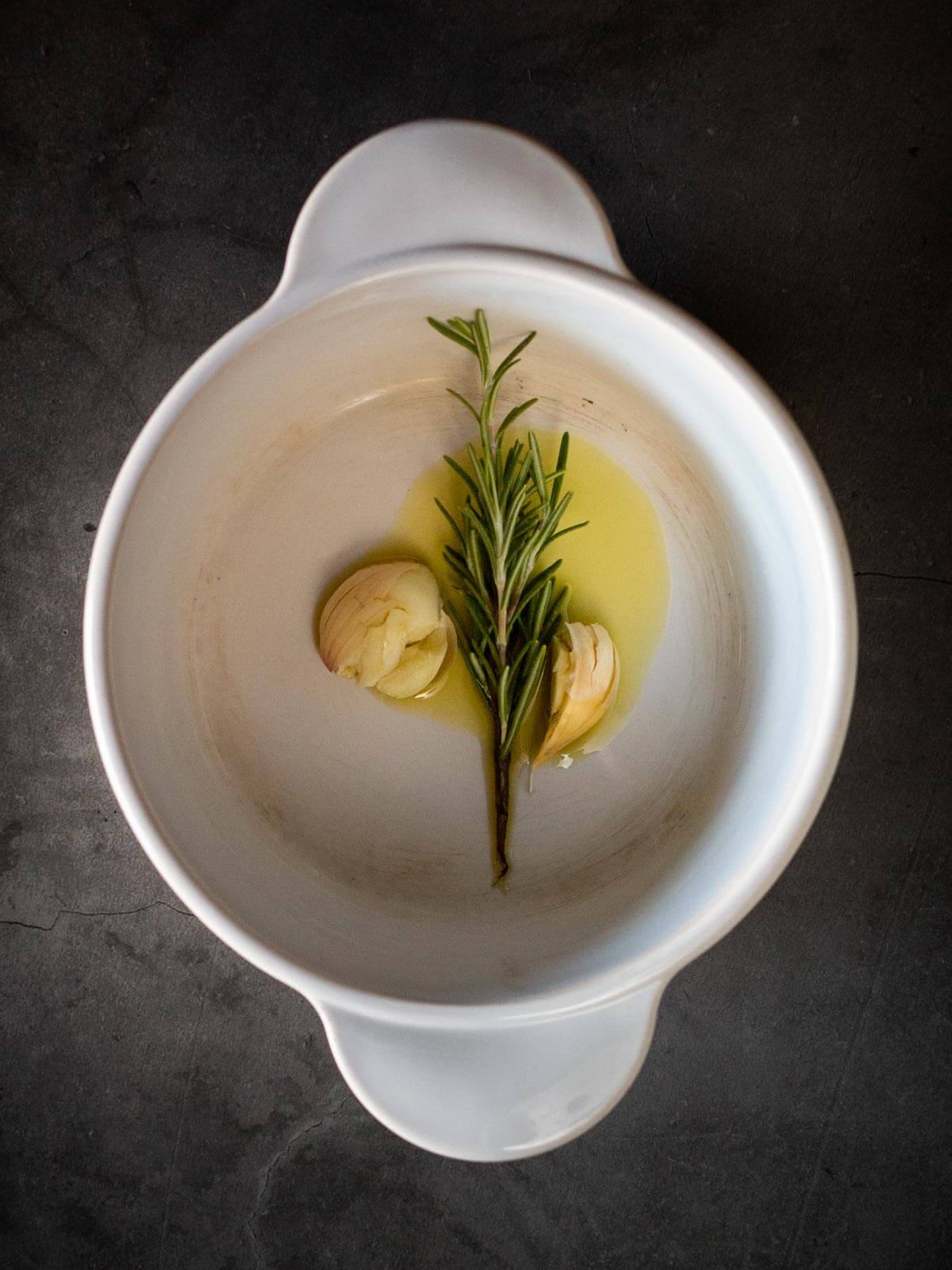 Infuse rosemary with garlic in olive oil.