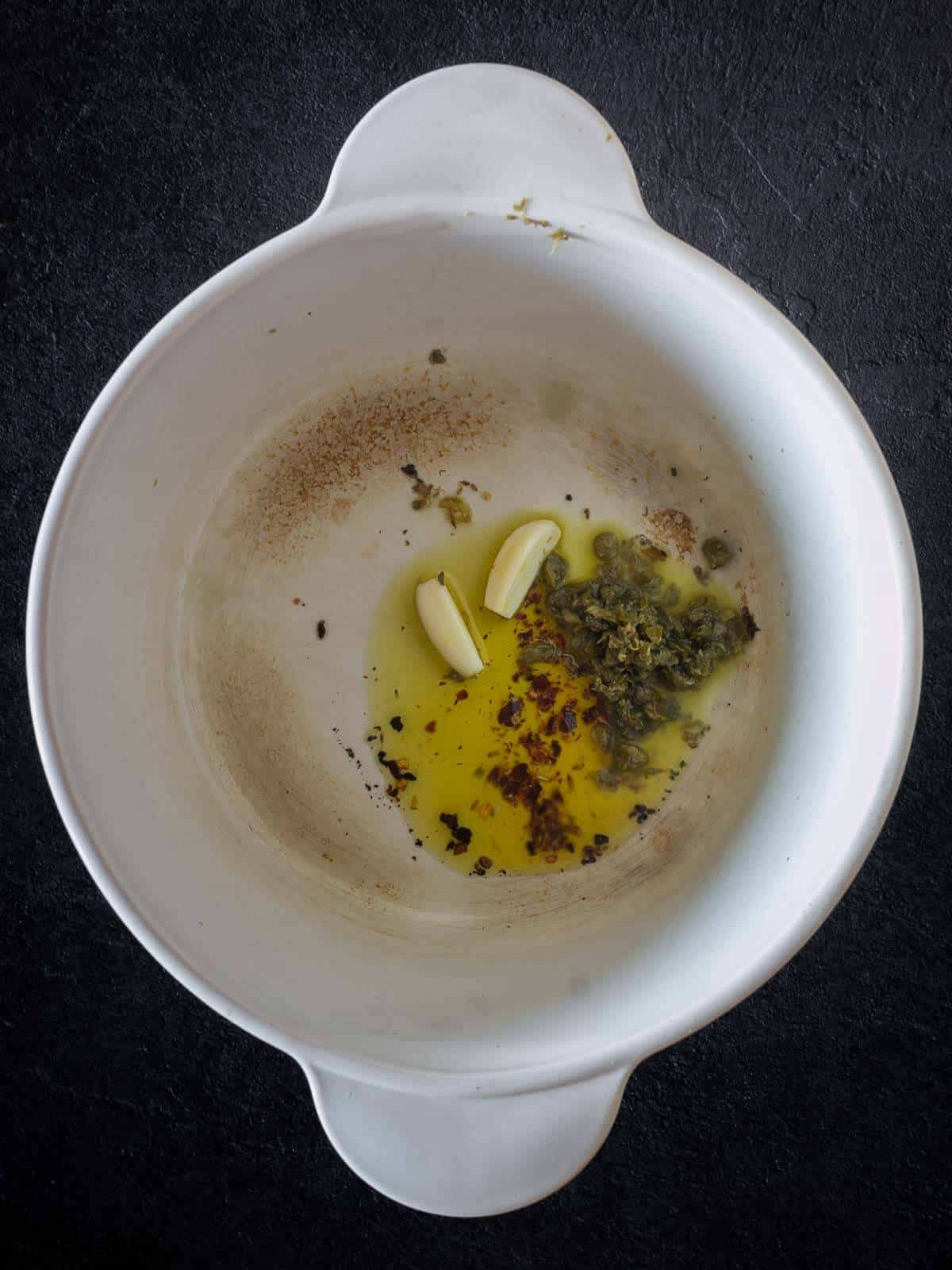 infuse olive oil with garlic, chili flakes and capers
