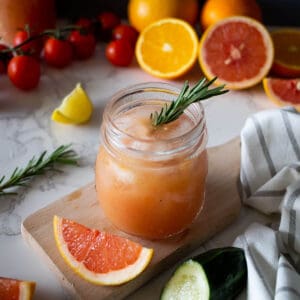 Citrus and Vegetable Juice with ice cubes featured.