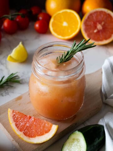 Citrus and Vegetable Juice with ice cubes featured.