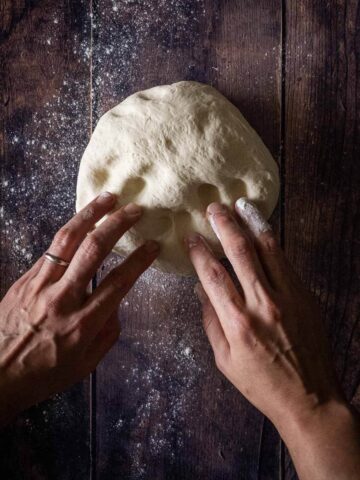 Pressing the dough with fingers.