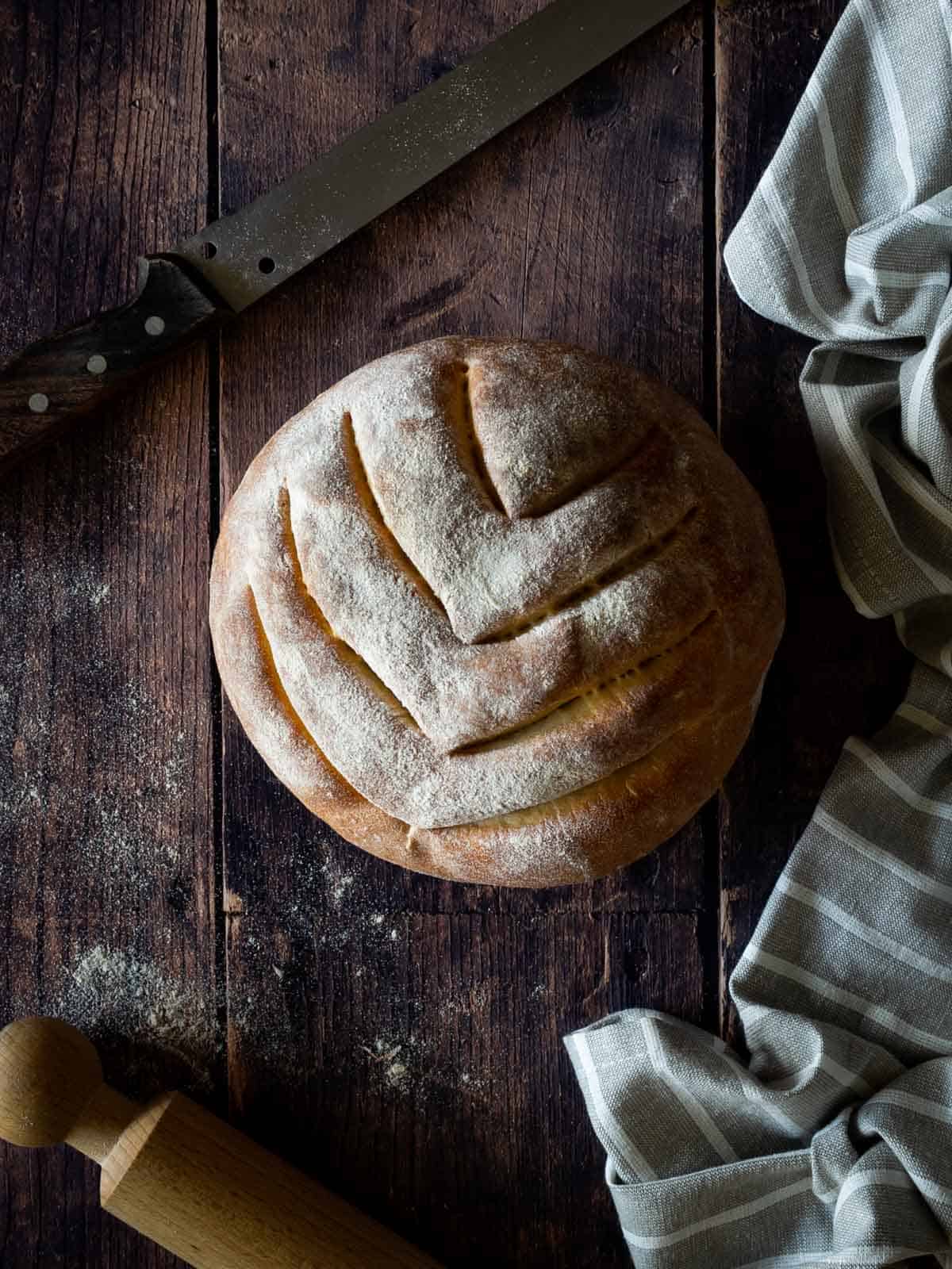 easy bread loaf on table with a knife.