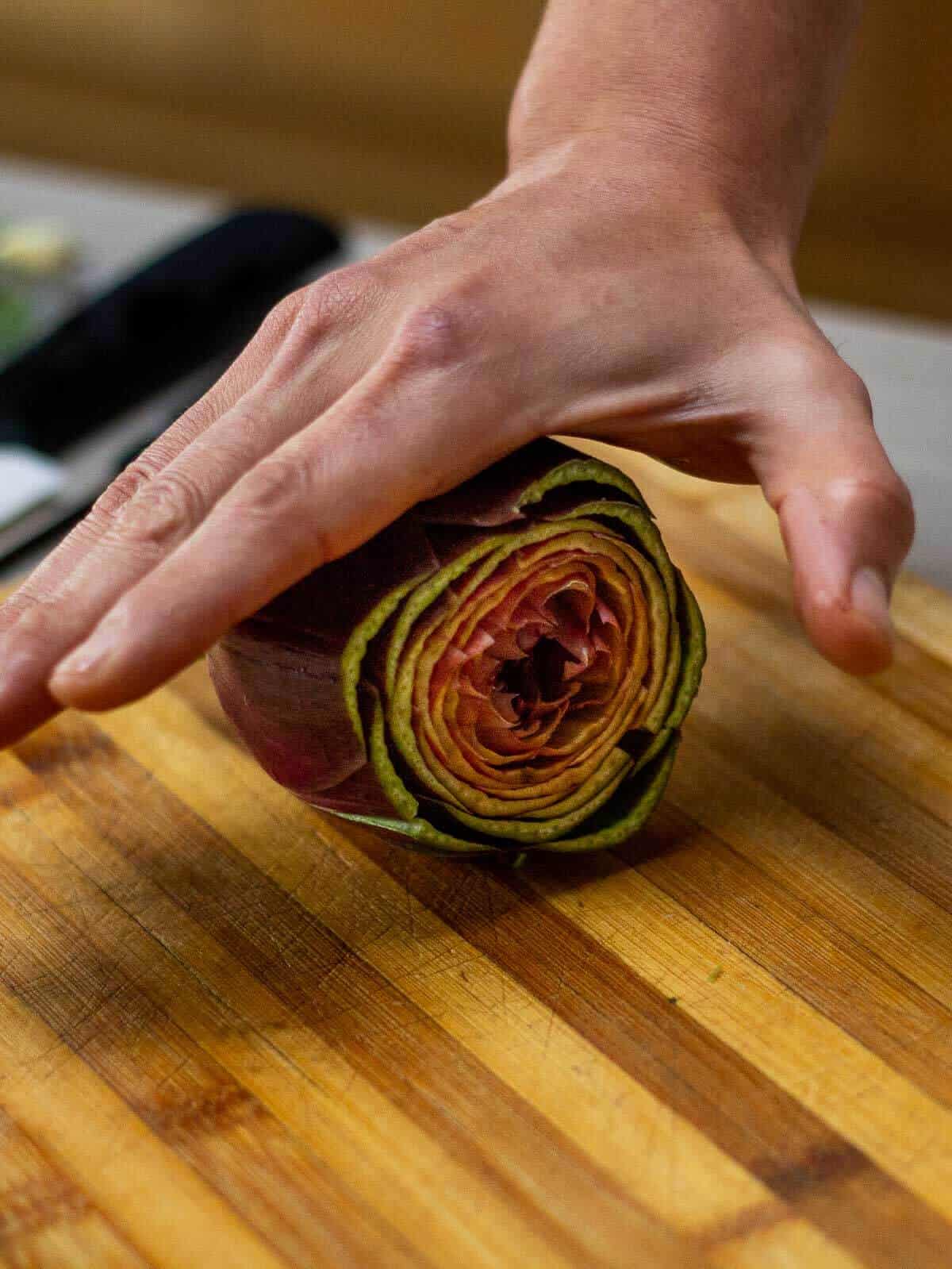 rolling artichokes to make them softer