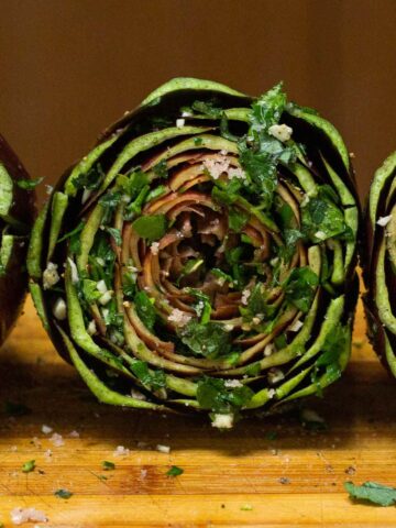 artichoke stuffed with the herbs mixed between each of the leaves and center.