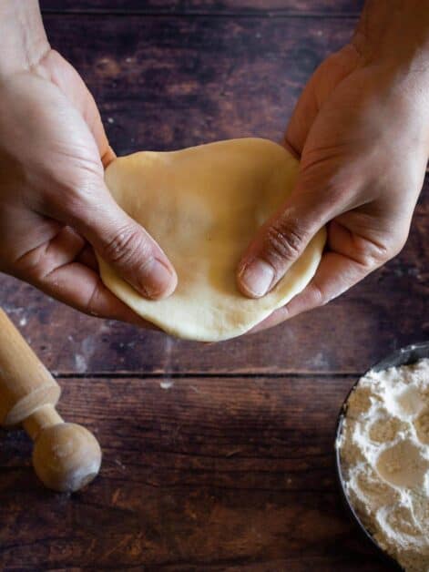 making empanadas discs with hand