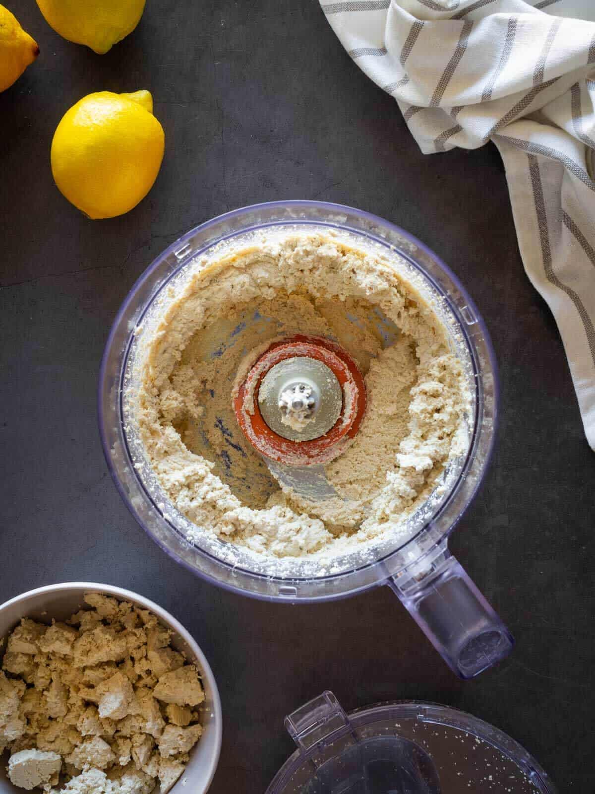 blending vegan ricotta cheese recipe in a food processor.