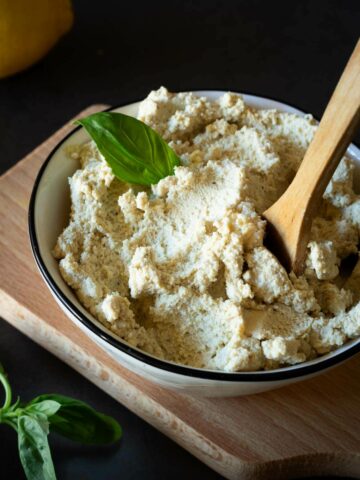 vegan ricotta to use in a small bowl with a spoon.