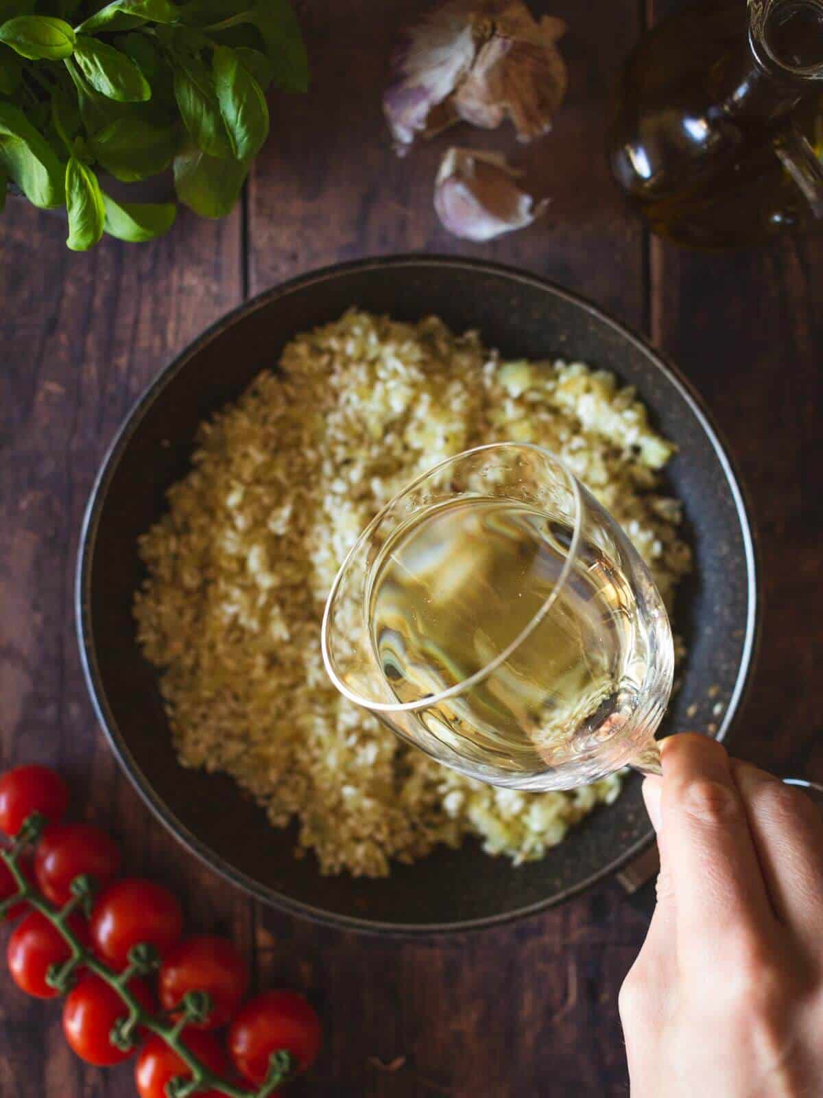 pour the white wine once the rice has dried out