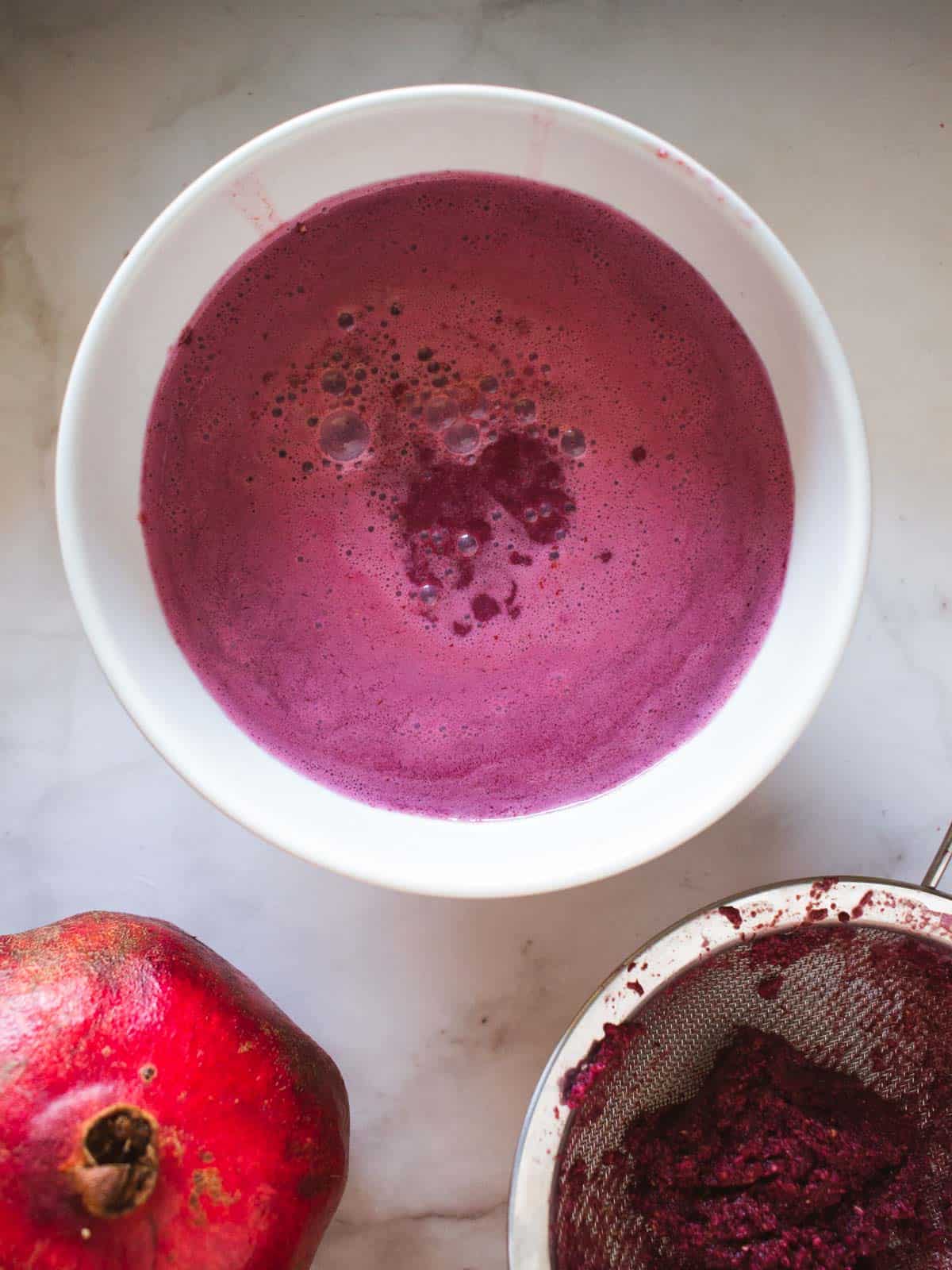 strained juice in a bowl