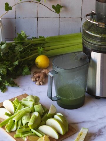 juicing celery juice with a juicer.