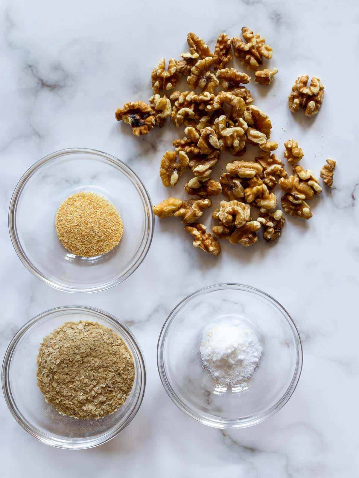 Ingredients to make vegan parm cheese on a table.