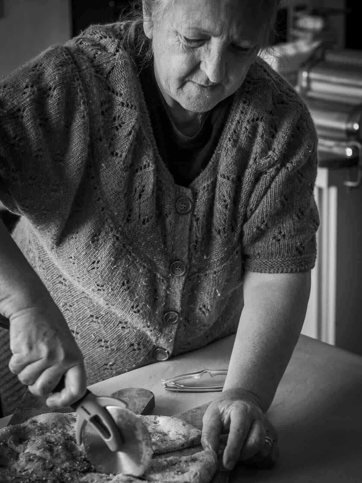 Mom cutting focaccia