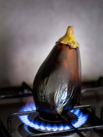 burning Eggplant in an open fire