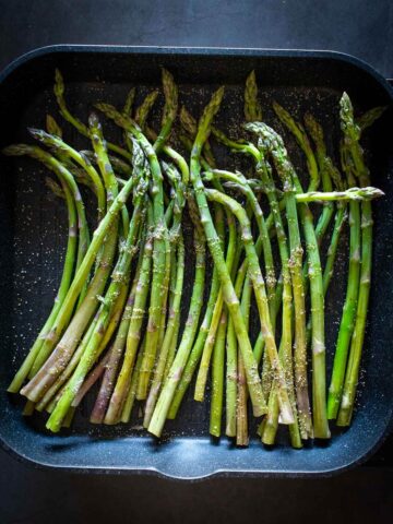 Grilling Asparagus on a stovetop grill.