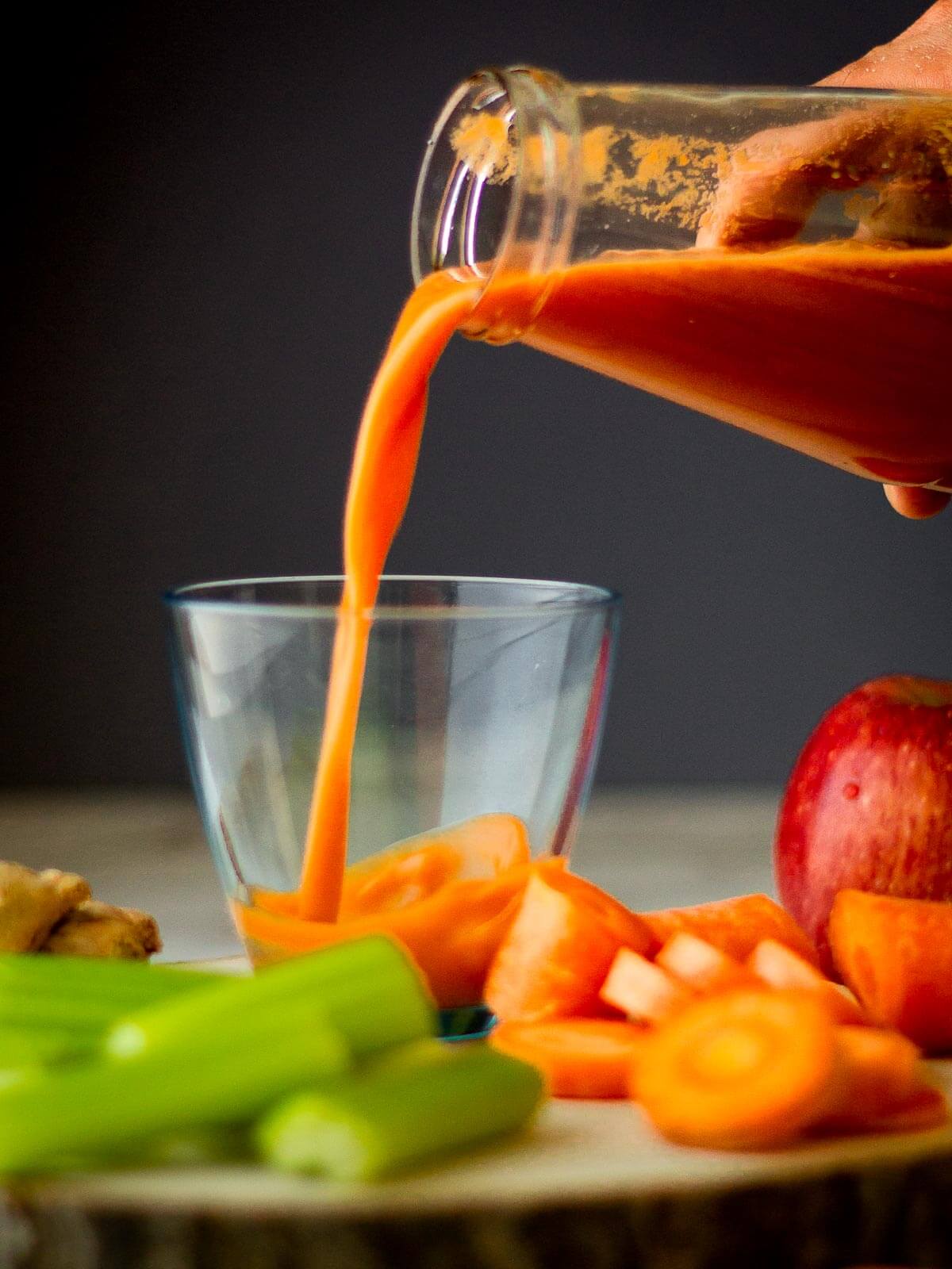 Pouring Carrot, Apple, and Celery Juice