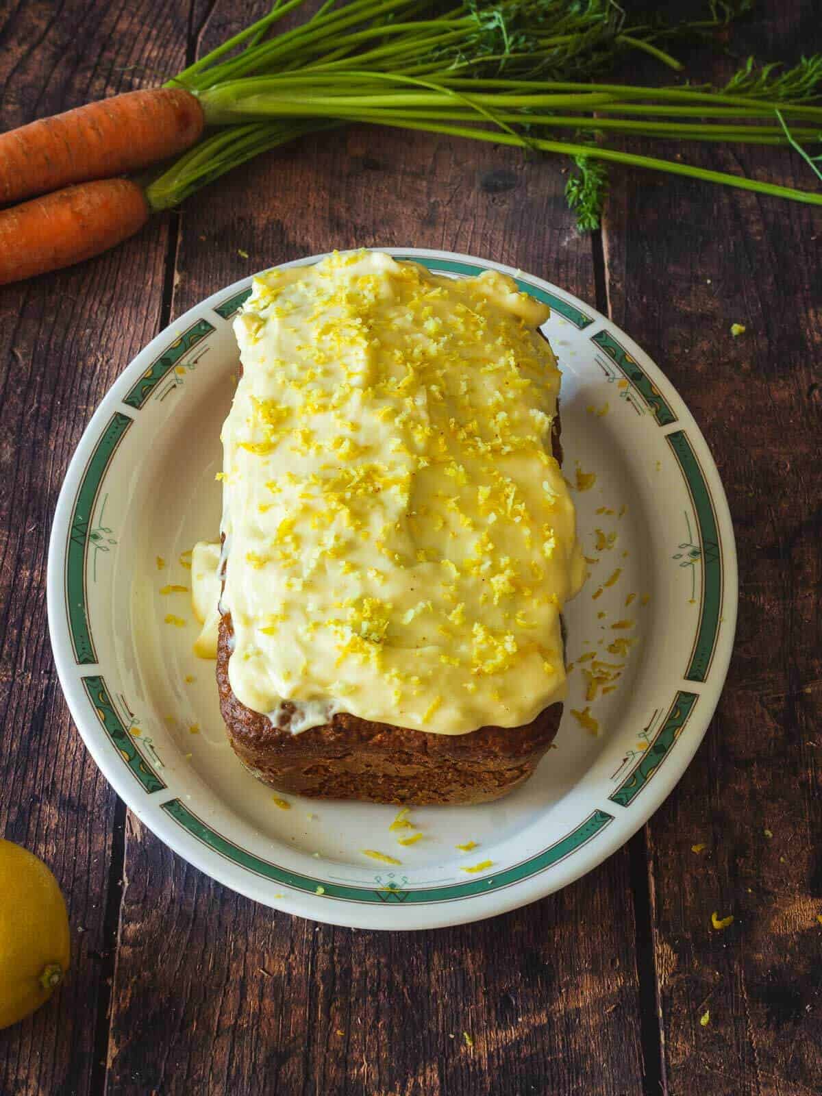 moist carrot loaf cake with frosting.