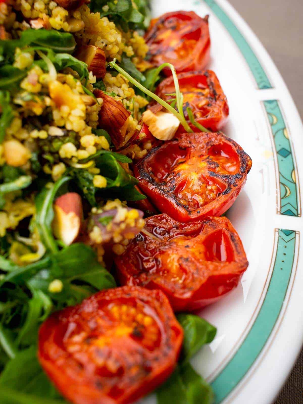 grilled cherry tomatoes-on top of couscous salad