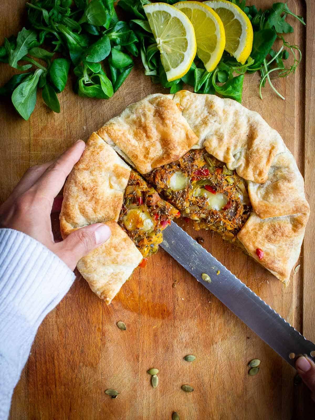 slicing savory carrot tart.