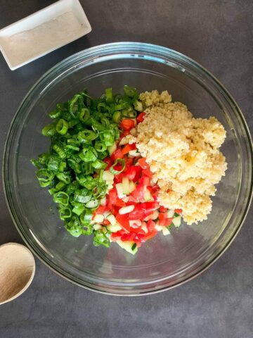 Add all the tabbouleh ingredients into a bowl.