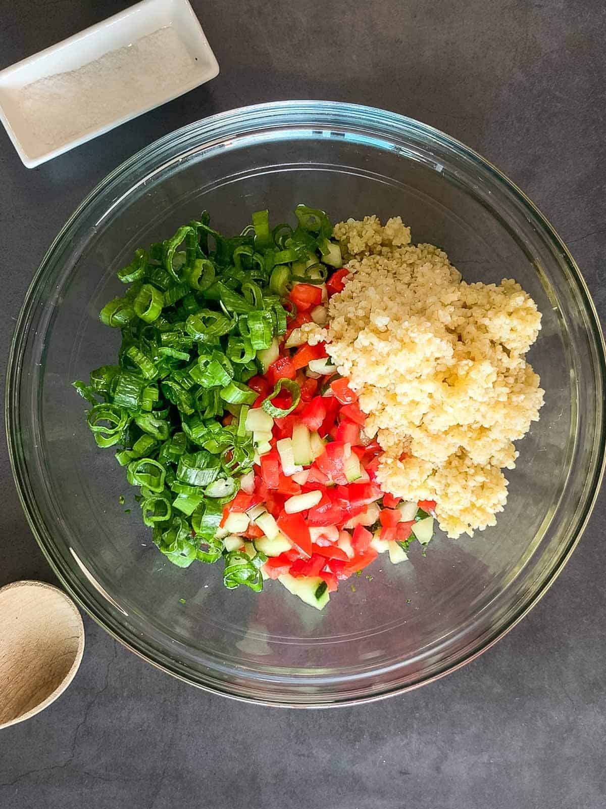 tabbouleh ingredients in a bowl ready to be mixed