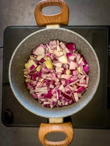 stir fry onions and garlic for vegan chili.