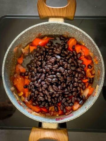 add black beans to the saucepan.