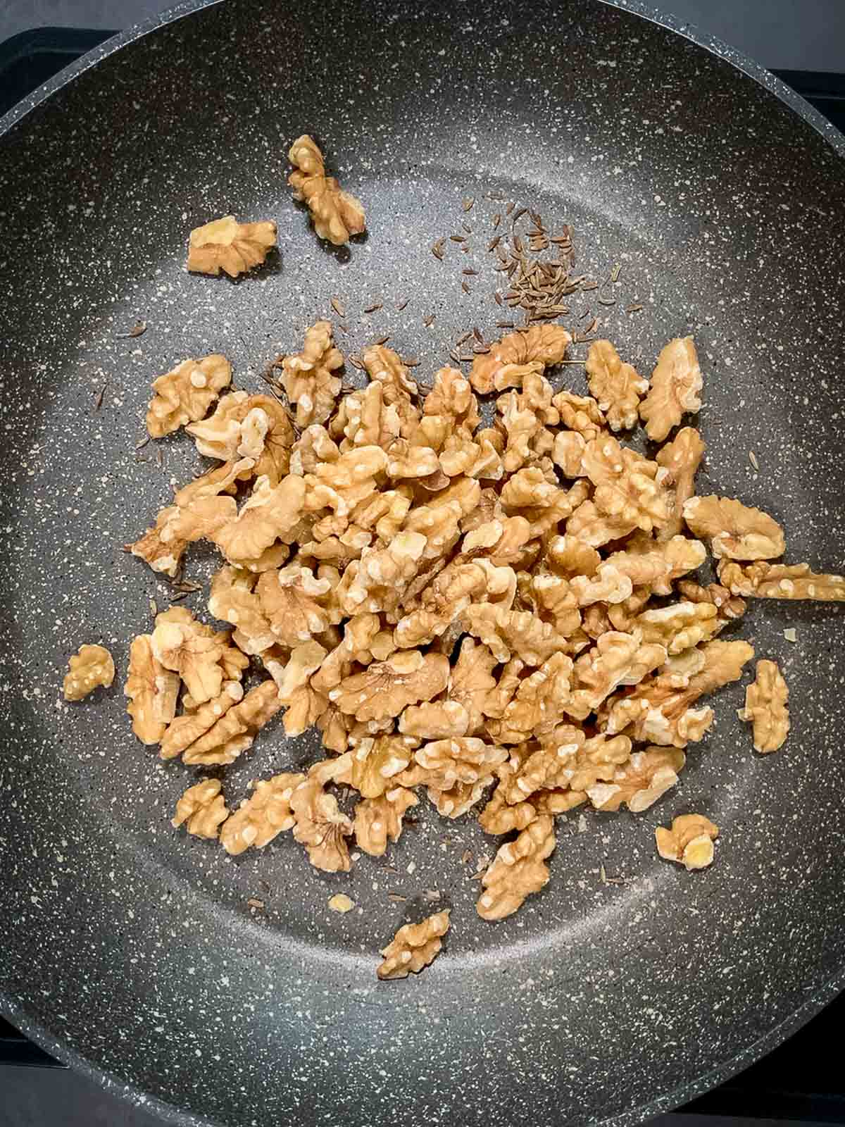 roast walnuts and cumin seeds