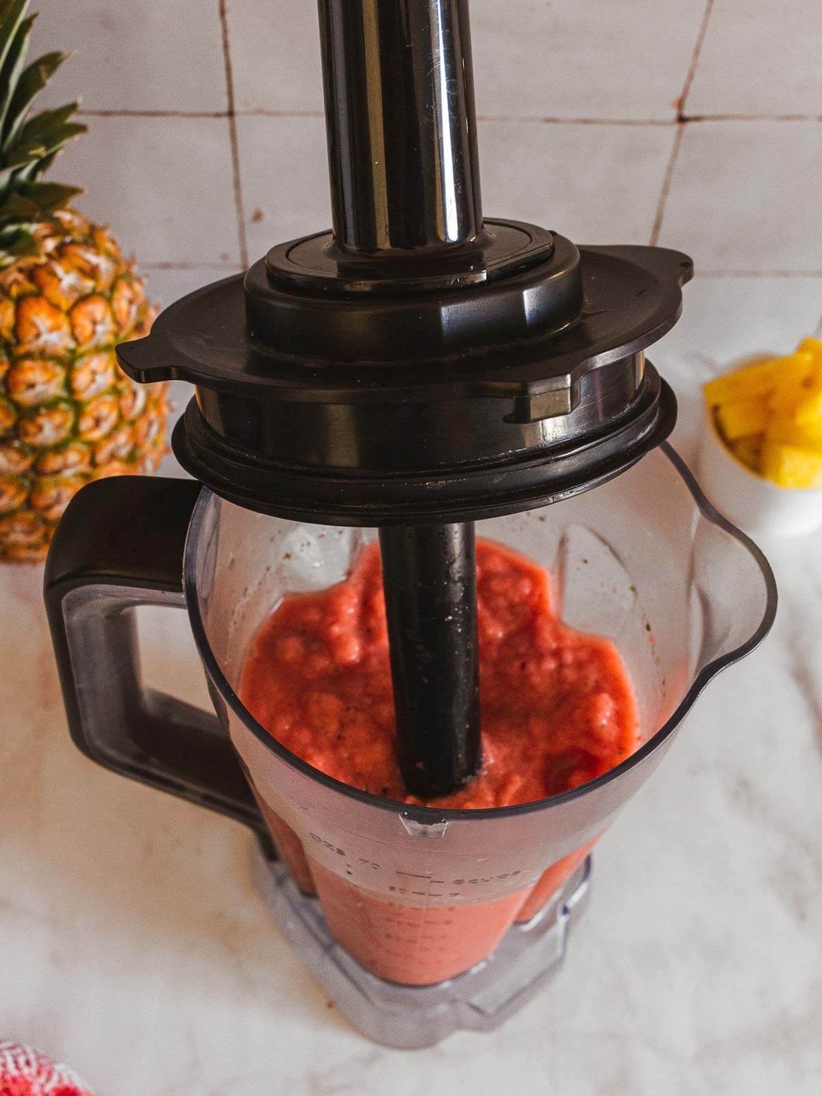 use the tamper to facilitate the blender's job