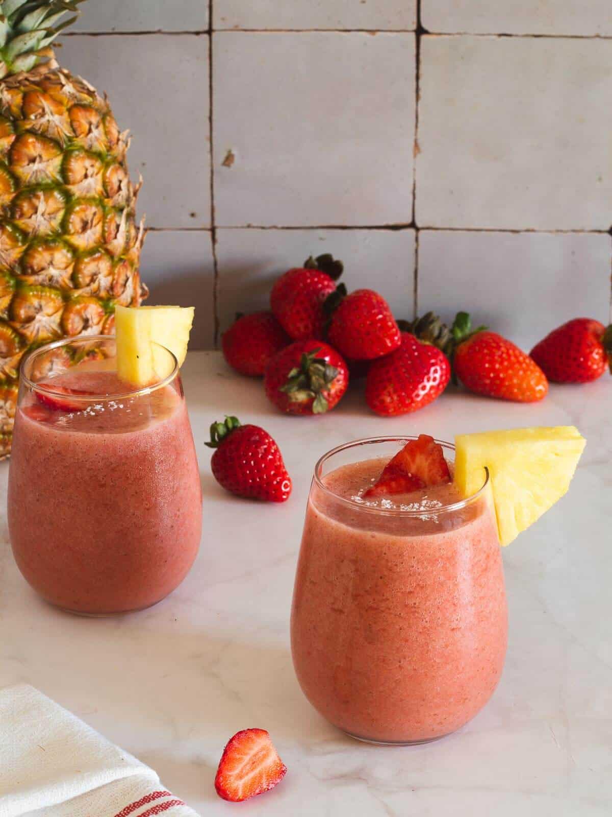 Creamy pineapple and strawberry breakfast smoothies - Simply Delicious