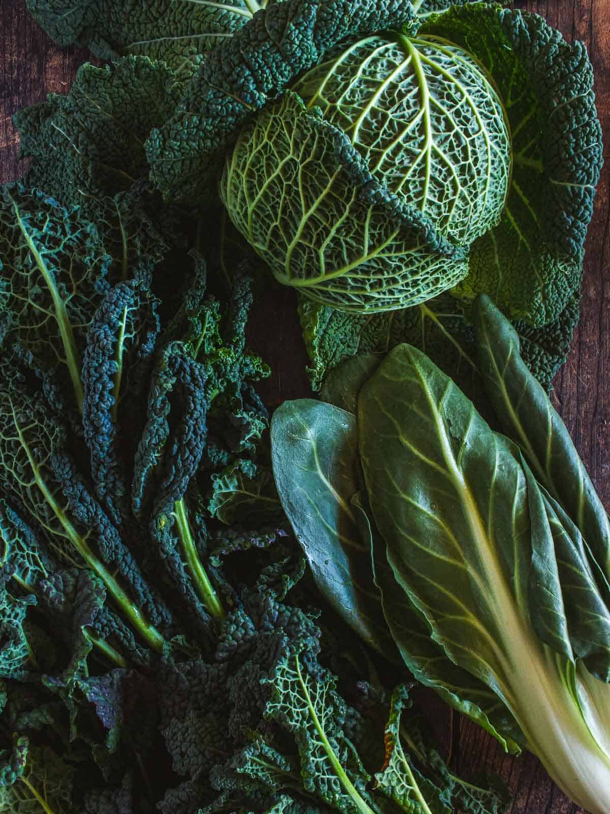 Green veggies and leafy greens including lascinato kale, white swiss chard, and savoy cabbage