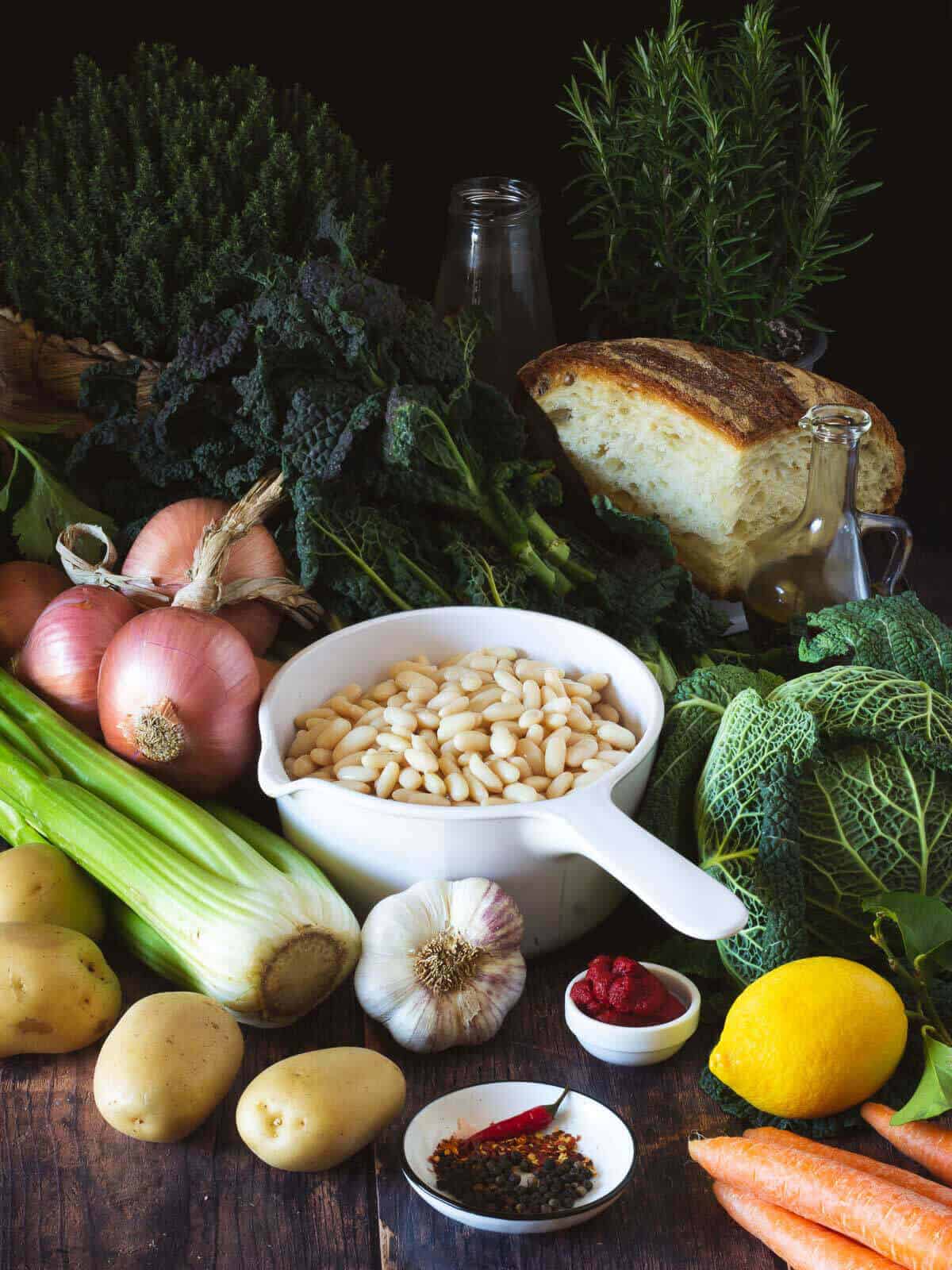 wooden table with all the bean soup ingredients